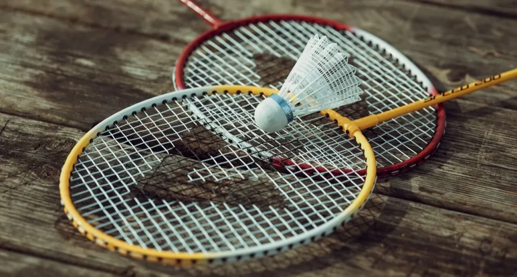 Close-up of badminton rackets and a shuttlecock