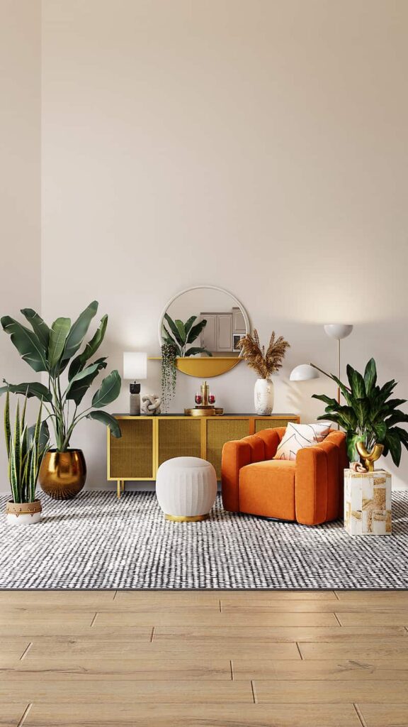a room with a light beige wall, an orange armchair, and multiple large potted plants. The centre of the room features a round mirror on the wall, with a cabinet below it.)