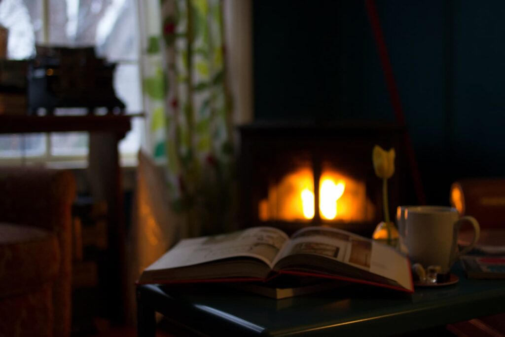 A cosy reading area with a fireplace
