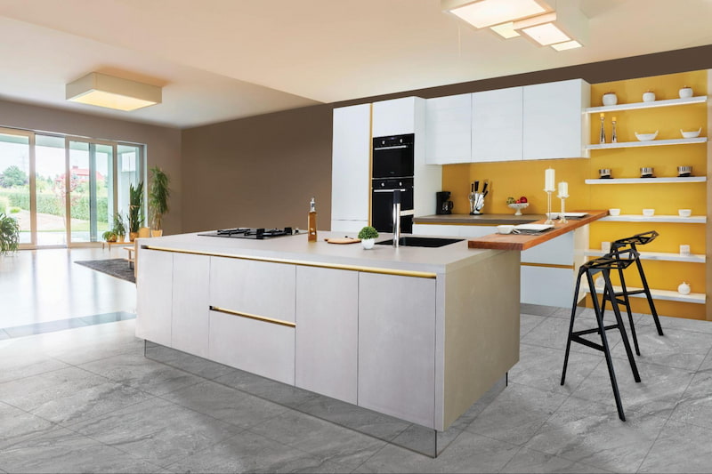 A modern looking kitchen, with white cabinets and yellow walls